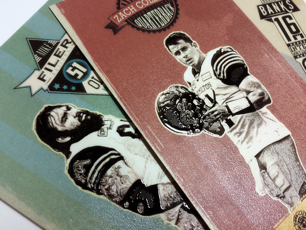 Printed tickets with special finishes and security elements fanned across a white surface