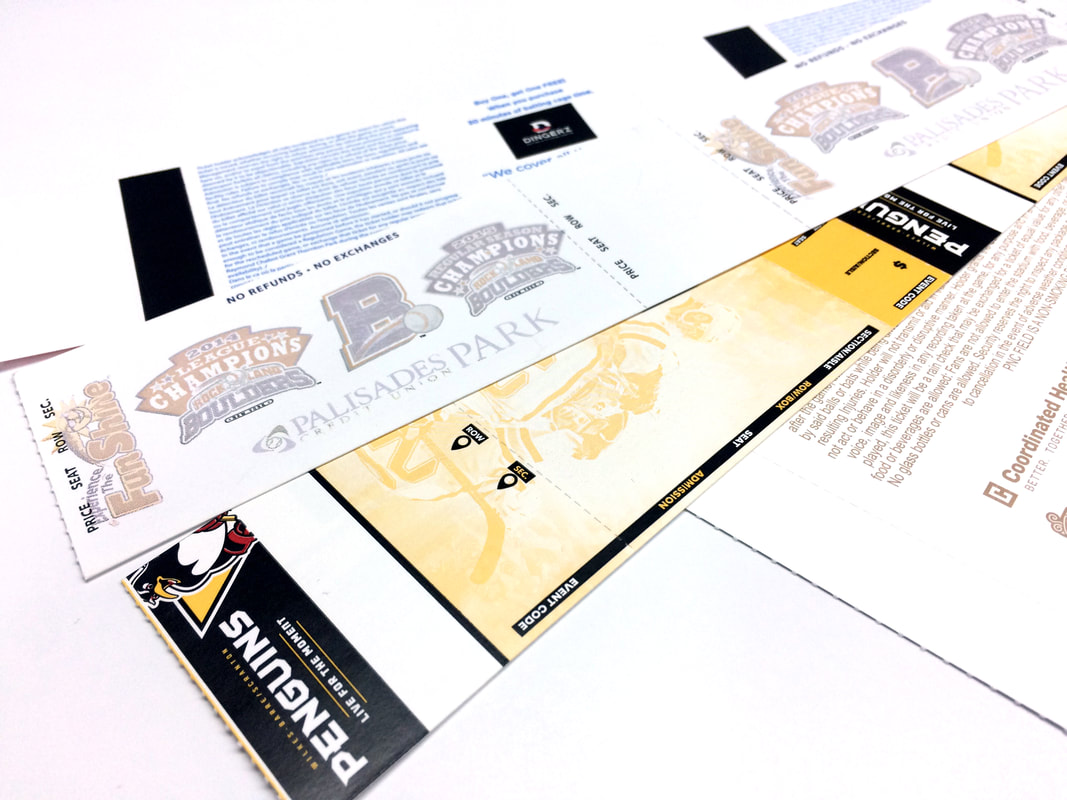 Printed thermal ticket stock laid out in overlapping rows, backs preprinted with conditions and sponsor artwork